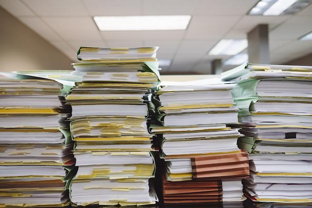 A messy stack of paperwork